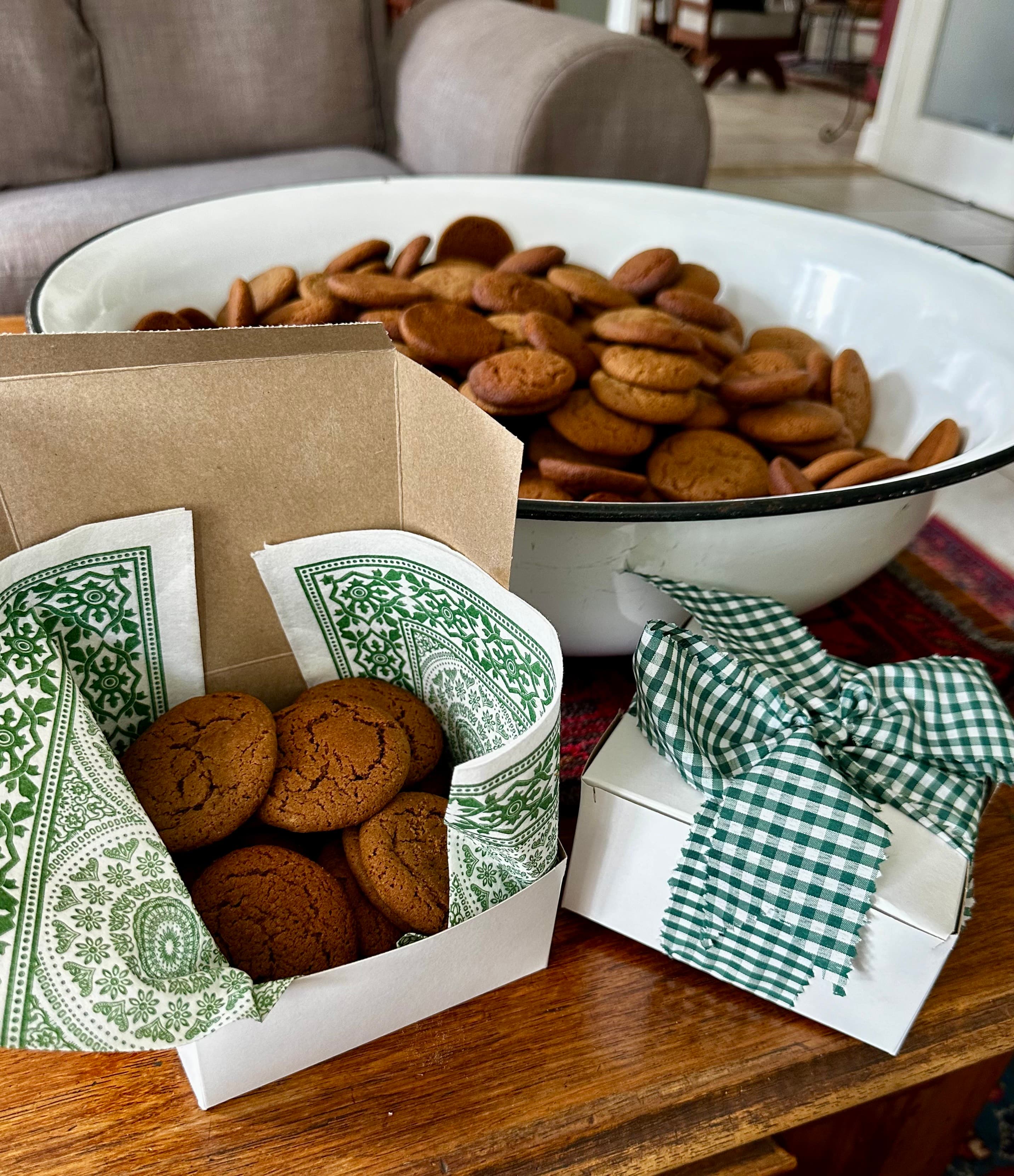 Gift boxes with bows and biscuits in bowls